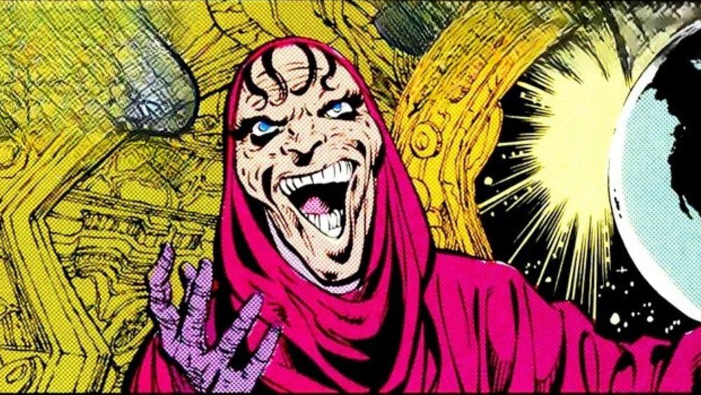 DeSaad con capucha magenta, el rostro al descubierto, en los cómics