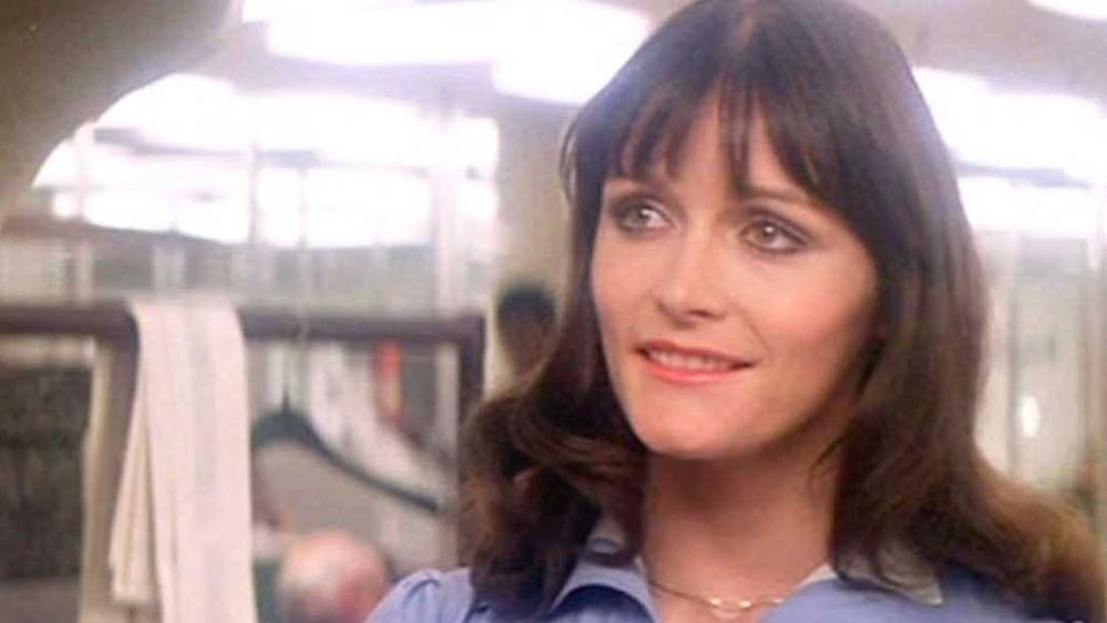 Margot Kidder como Lois Lane, blusa azul, en Superman de 1978